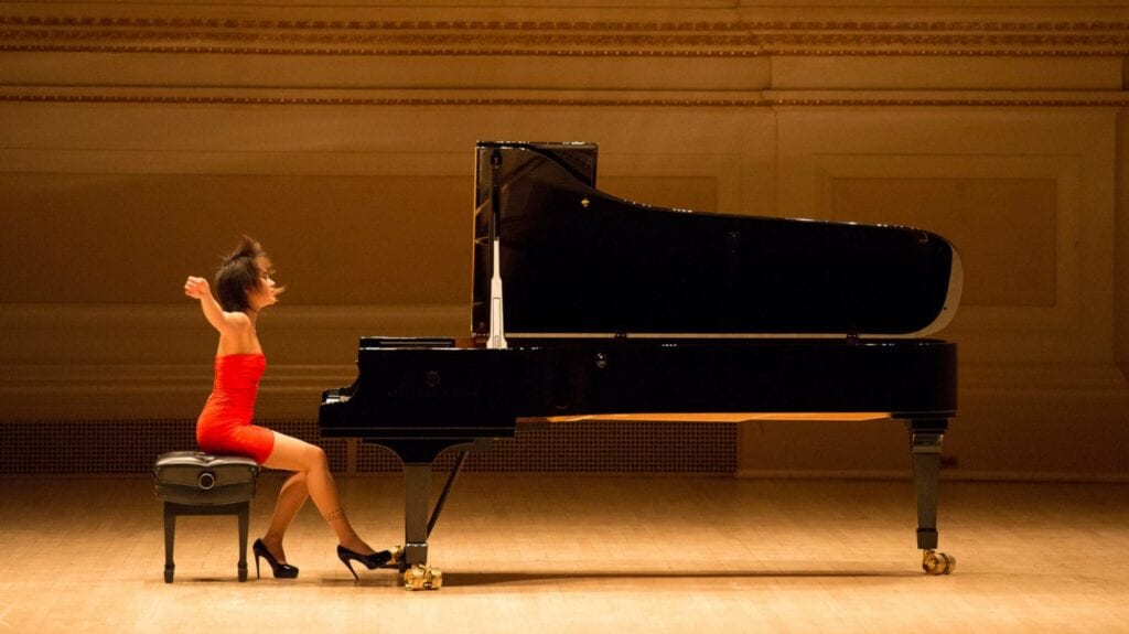 Photo of Chinese concert pianist and Steinway Artist Yuja Wang at her Model D Steinway.