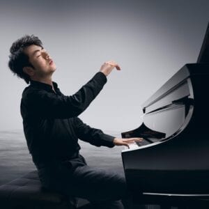 Photo of Steinway Artist Lang Lang playing a Model D.