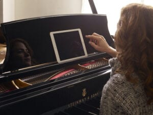 Photo of woman using IPad interface