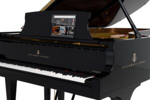 Photo of Steinway Spirio self-playing piano with iPad interface.