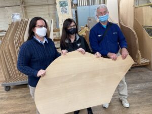 Fitchburg State music faculty with a Steinway soundboard