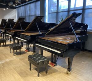 A row of finished Steinway grand pianos at the Astoria, NY facility.