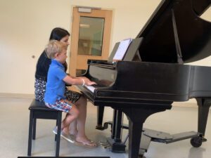 Colin Murphy and teacher at piano