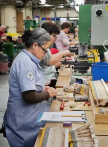 Craftspeople making the hammers for the Steinway action.